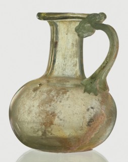Jug, Egyptian workshop, spherical flattened body, cylindrical neck, flared spout and ribbon-shaped