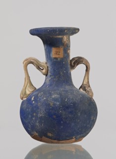 Amphora, bulging belly with a rounded bottom, long cylindrical neck with a thick ring-shaped rim;