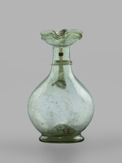 Oinochoe, Transparent, light green glass; spherical belly on a foot with a clearance, created by