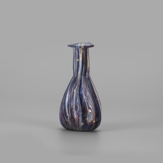 Unguentarium, unknown eastern workshop, translucent glass, mosaic: blue-violet-white. Pear-shaped