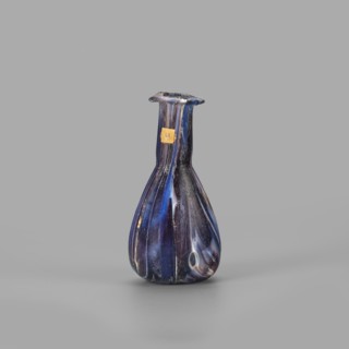 Unguentarium, unknown eastern workshop, translucent glass mosaic blue-violet-white. Pear-shaped