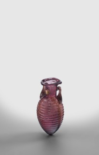 Amphora, unknown eastern workshop; translucent manganese glass; elongated ovoid body covered with