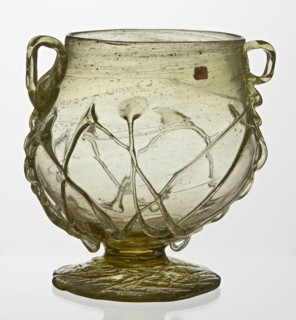 Skyphos, Deep bowl with wide foot and two small vertical handles. Surface decorated with a zigzag