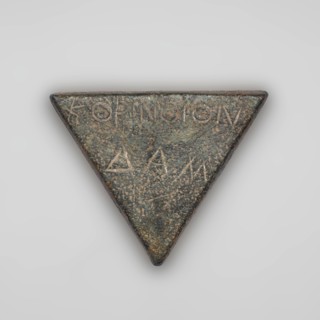 Weight 1/6 mina. Weight in the shape of an isosceles triangle. On the weight is a two-line