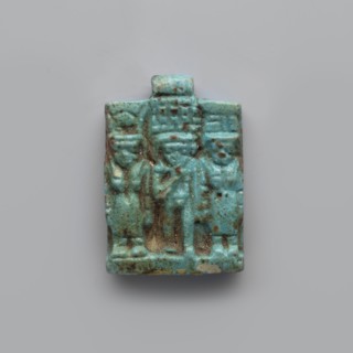 Amulet – plaque with a triad of deities, Harpocrates Horus, Isis, Nephthys. Amulet in the shape of