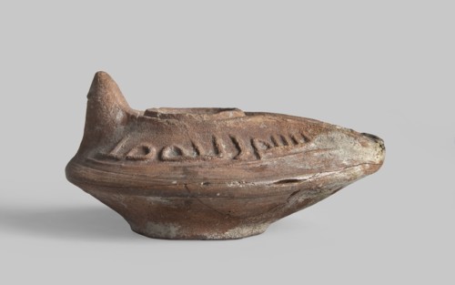 Oil lamp, Oval lamp from a mold. Gently sloping arms with a Kufic inscription bismi l'lahi mina