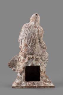 Figurine of Leda with a Swan, A woman sits on a rock and feeds a swan standing next to her. She is