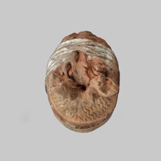 Head of a woman, Female head, fragment of a larger figurine. The head is tilted slightly to the