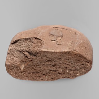 Fragment of a transport amphora vice with a stamp depicting an oinochoe and an incomplete Greek