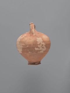 Jug, unknown Aswan workshop. Jug with a rounded rim, a narrow and upwardly flaring neck with a