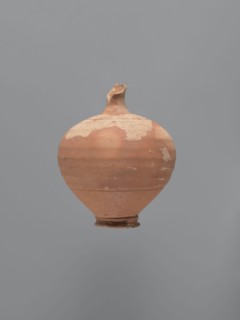 Jug, unknown Aswan workshop. Jug with a rounded rim, a narrow and upwardly flaring neck with a