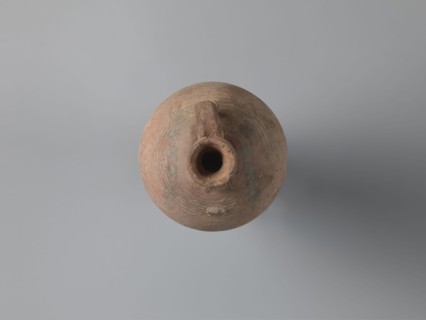 Bottle, unknown Egyptian workshop. Bottle with a rounded and falling rim, concavely profiled. The