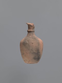 Jug, unknown Aswan workshop. Jug with a rounded outward-turning rim, cylindrical neck, tapering at