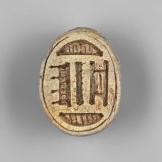 Scarab — possibly a forgery. Scarab amulet with a pseudo-inscription on the underside of the base.