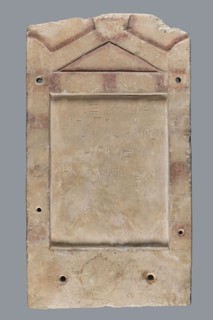 Stela Alexis, Small limestone stele with simple architectural decoration. Recessed epigraphic field