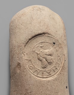 Fragment of a transport amphora vice stamped with a Rose of Rhodes and the inscription Chresimou,