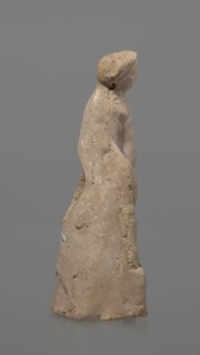 Terracotta figurine of Heracles. Figurine of a standing naked Heracles in a contrapposto pose with