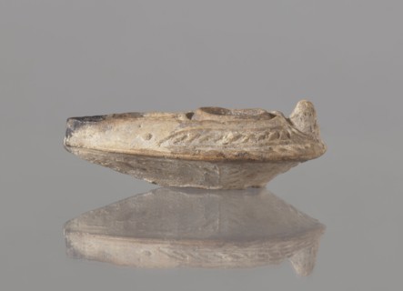 Oil lamp, unknown Palestinian workshop. Oval lamp with conical handle. Large olive opening