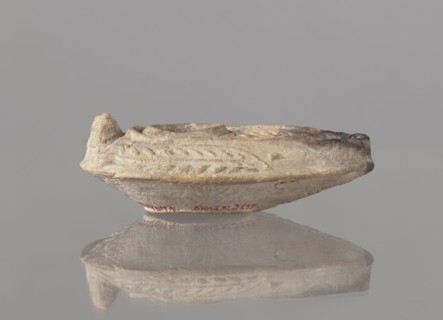 Oil lamp, unknown Palestinian workshop. Oval lamp with conical handle. Large olive opening