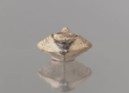 Oil lamp, unknown Palestinian workshop. Islamic art, Arabic culture. Oval lamp with conical handle.
