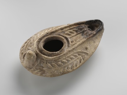 Oil lamp, unknown Palestinian workshop. Oval lamp with conical handle. Large olive opening