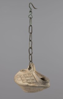 Lamp, Egyptian Coptic art, antiquity; oval oil lamp made of yellow-gray clay with a high container