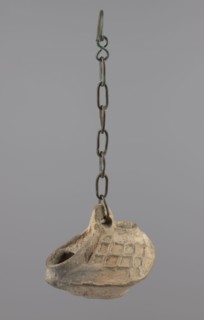 Lamp, Oval lamp made of yellow-gray clay with a high container and two handles, through which a