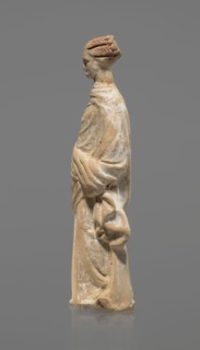 Terracotta figurine of a standing woman, terracotta, female figurine, himation, chiton, Tanagra