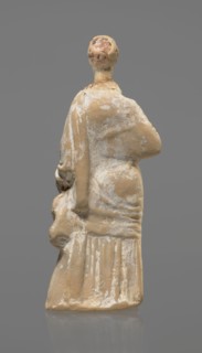 Terracotta figurine of a standing woman, terracotta, female figurine, himation, chiton, Tanagra