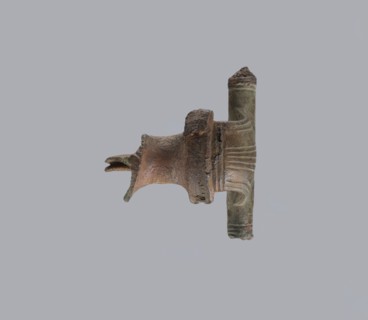 Brooch with a crossbar. Brooch with a bow made of a wide, slightly curved band decorated with