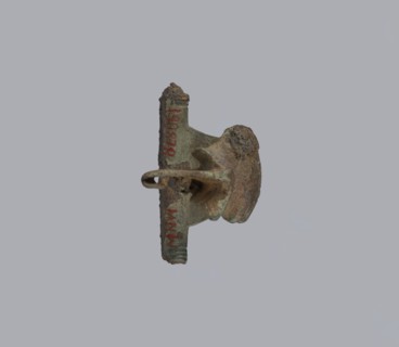 Brooch with a crossbar. Brooch with a bow made of a wide, slightly curved band decorated with