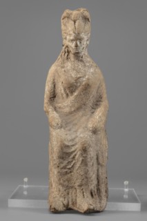 Female figurine, unknown creator/workshop, Female figure in a seated position, slightly leaning