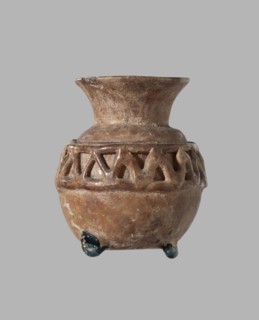 Cosmetic bottle. Spherical body decorated at the top with a zigzag pattern of applied glass thread.