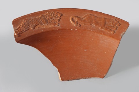 Fragment of a terra sigillata plate. Fragment of the rim of a deep plate with a flat, wide rim and