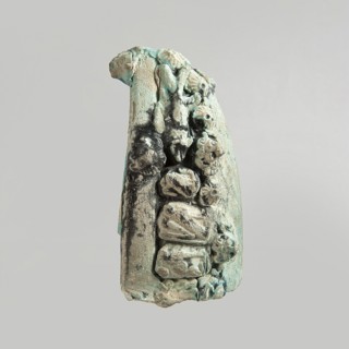 Fragment of a votive boat. Prow or stern with decoration in the form of glued appliqués. On the
