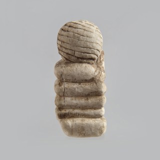 Fragment of a figurine. Head of a polychrome figurine, which originally probably depicted a woman