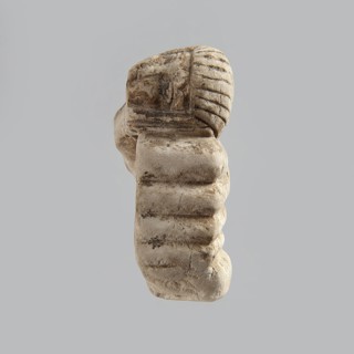 Fragment of a figurine. Head of a polychrome figurine, which originally probably depicted a woman