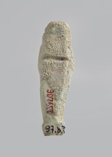 Ushabti. Carelessly made figurine with schematic facial features, in a narrow wig revealing the