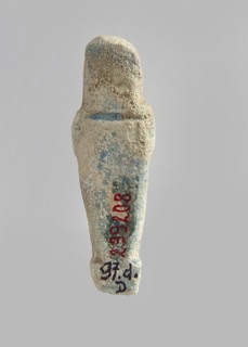Ushabti. Carelessly made figurine with schematic facial features, in a narrow wig revealing the