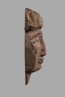 Sarcophagus mask with a partially preserved fragment of a wig above the forehead painted yellow
