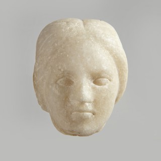 Fragment of a female figurine. Fragment of a small-sized sculpture or sculptural group. The