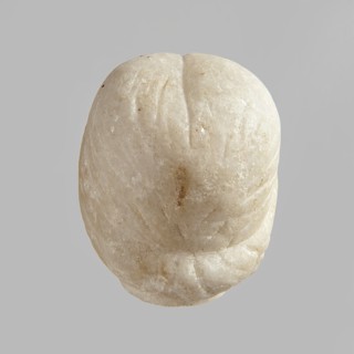 Fragment of a female figurine. Fragment of a small-sized sculpture or sculptural group with