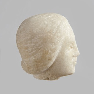 Fragment of a female figurine. Fragment of a small-sized sculpture or sculptural group with