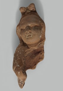 Harpocrates; preserved head and part of the right side of the figurine; traces of engobe on the