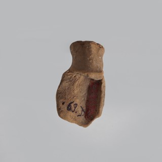 Serapis, fragment of a terracotta figurine head of Serapis with a kalathos on the head, lush curls