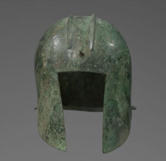 Bronze helmet with rectilinear cutouts for the eyes, nose, mouth, and chin, with two prominent