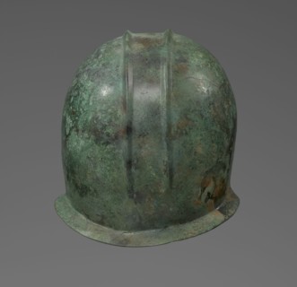 Bronze helmet with rectilinear cutouts for the eyes, nose, mouth, and chin and two prominent