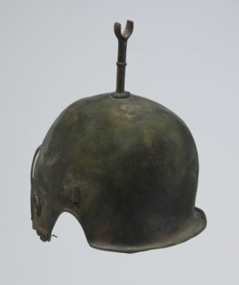 Bronze helmet, 4th–3rd century BC, Italy, armament; height 27 cm without cheek guards, width 19.8