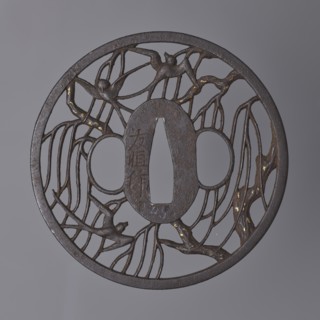 Crossguard tsuba by Nakai Tomotsune II. Early 18th century Edo period, 1603–1868. Iron round tsuba