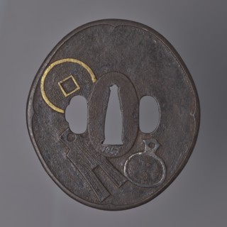 Crossguard tsuba, Umetada school; maker: Umetada Shigeyoshi. Oval tsuba tatemaru gata with a